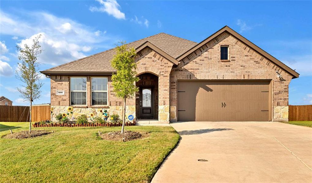 Front exterior of a new home in , Caddo Mills, TX, highlighting curb appeal (Image 2).