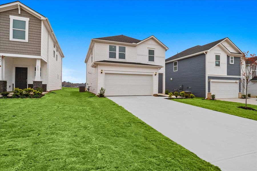 Front exterior of a new home in The Farm at Wells Creek - Heritage Collection, Gray Court, SC, highlighting curb appeal (Image 2). Front exterior of a new home in The Farm at Wells Creek - Heritage Collection, Gray Court, SC, highlighting curb appeal (Image 2).