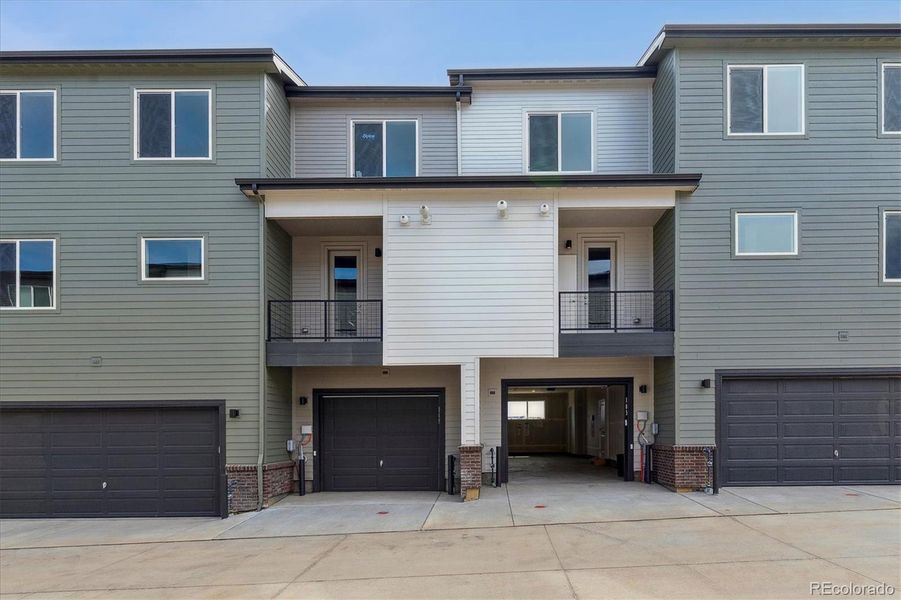 Front exterior of a new home in Townhome Collection at Grand Vue at Interlocken, Broomfield, CO, highlighting curb appeal (Image 2).