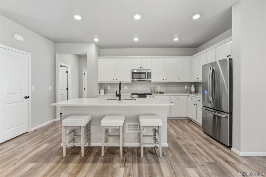 Furnished interior view inside a new home in Woodrose at Painted Prairie, Aurora (Image 11).