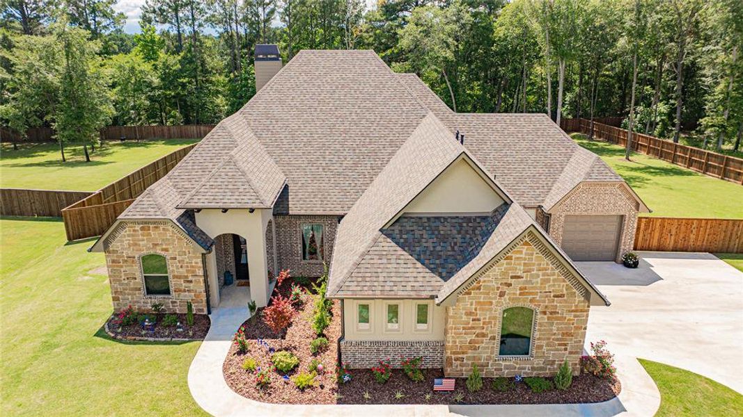 Front exterior of a new home in , Longview, TX, highlighting curb appeal (Image 18). Front exterior of a new home in , Longview, TX, highlighting curb appeal (Image 18).