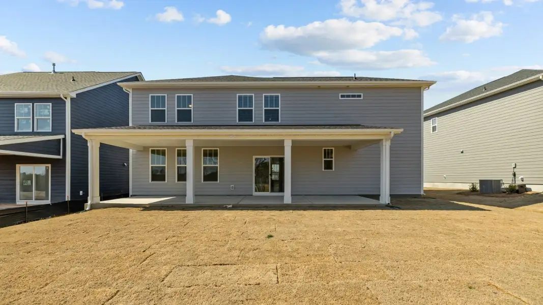 Norris Design expansive rear covered porch. At Lakeside Glen by premier builder DRB Homes in York, SC. Norris Design expansive rear covered porch. At Lakeside Glen by premier builder DRB Homes in York, SC.