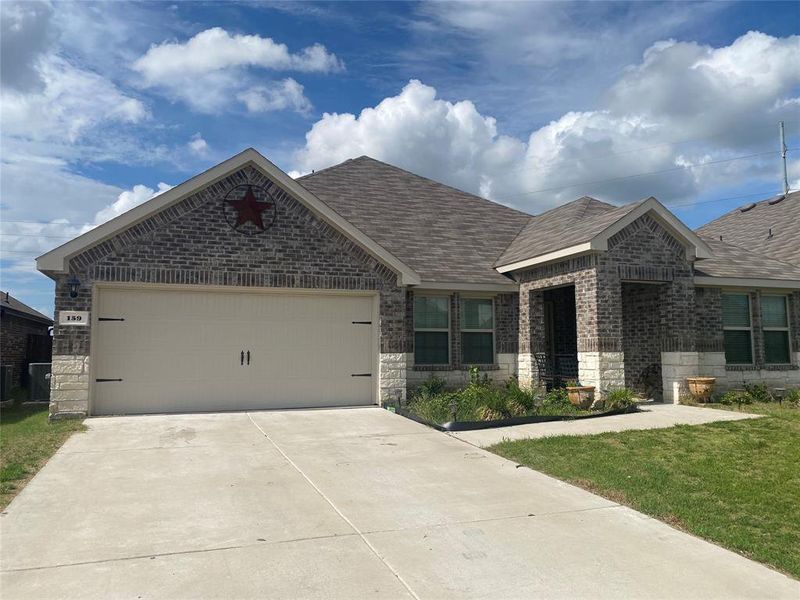 Front exterior of a new home in Stonehaven, Caddo Mills, TX, highlighting curb appeal (Image 8). Front exterior of a new home in Stonehaven, Caddo Mills, TX, highlighting curb appeal (Image 8).