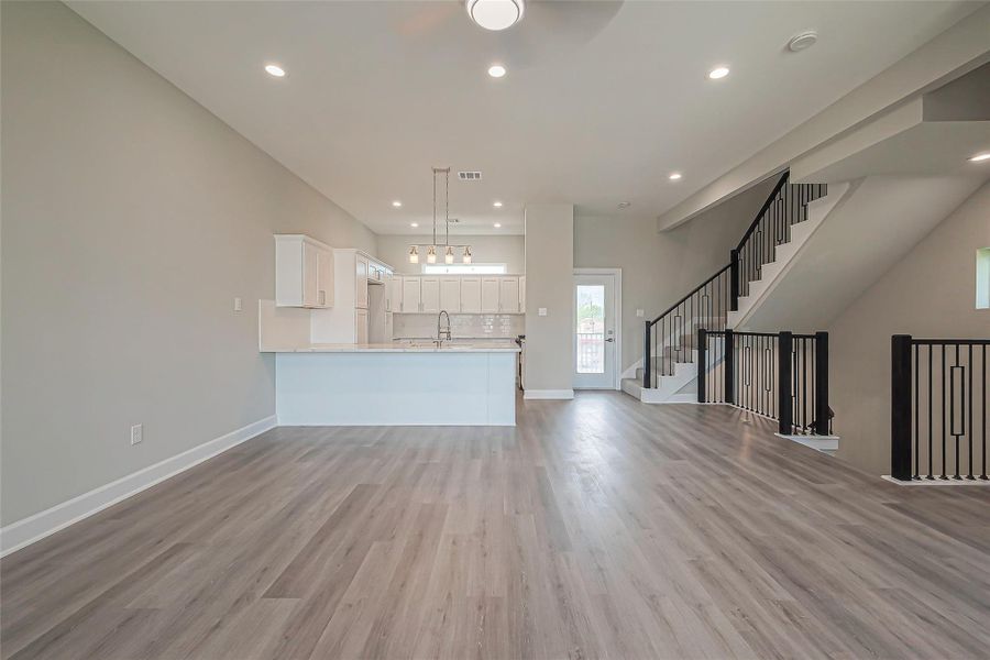 Unit 2: spacious main floor with living room and kitchen.