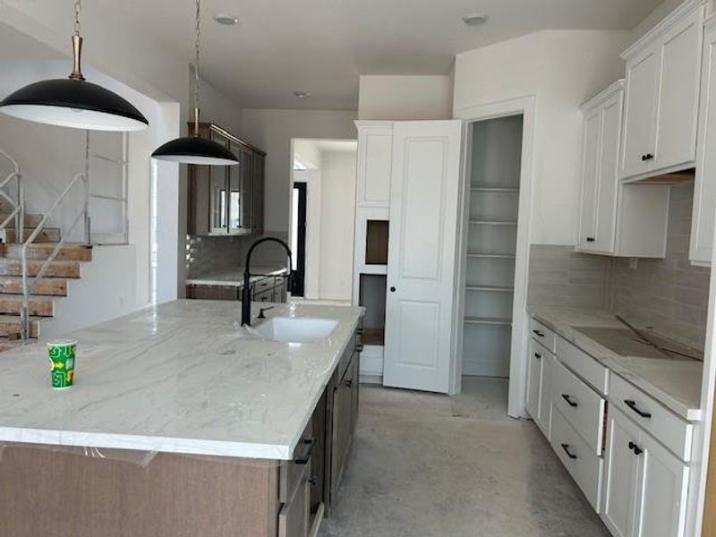 Kitchen joy with the porcelain counters and hardware installed.