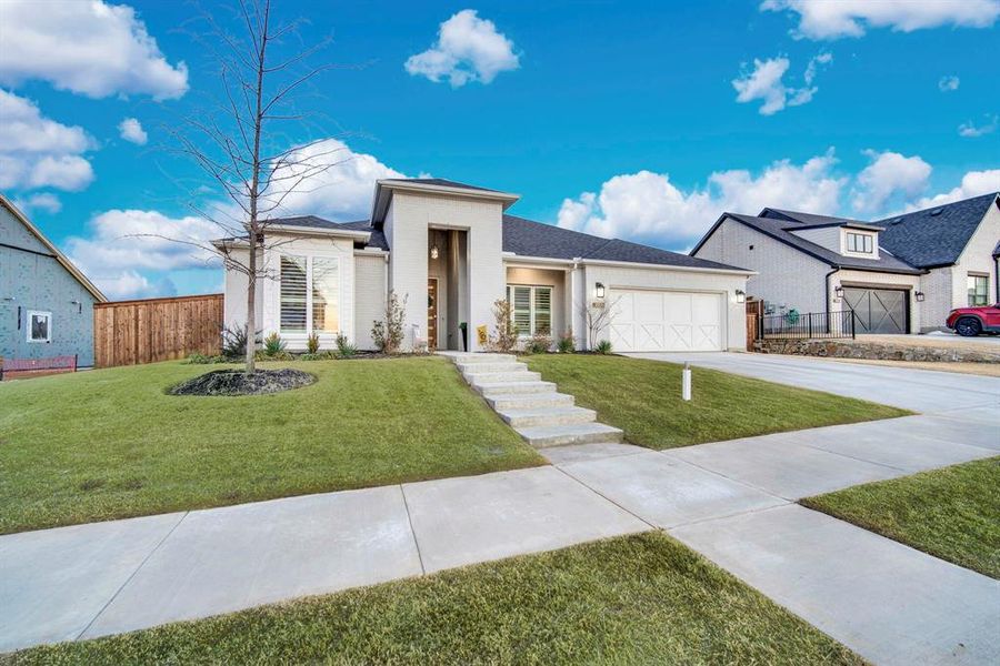 Front exterior of a new home in Sweetgrass, Haslet, TX, highlighting curb appeal (Image 22).