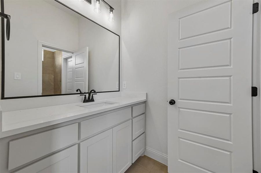 Bathroom with tile floors and vanity