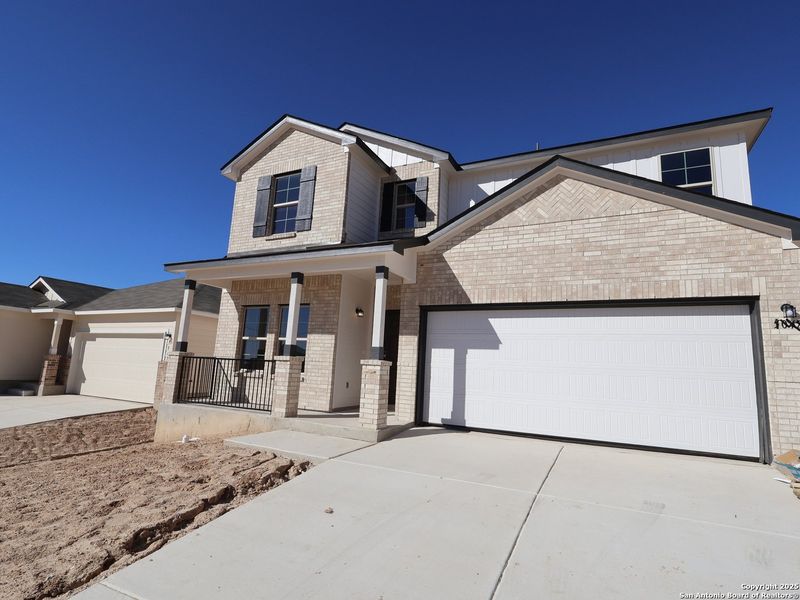 Front exterior of a new home in Agave, San Antonio, TX, highlighting curb appeal (Image 1).