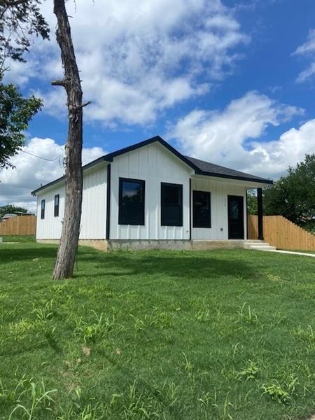 A newly constructed residence features modern siding and a neatly maintained lawn. A newly constructed residence features modern siding and a neatly maintained lawn.