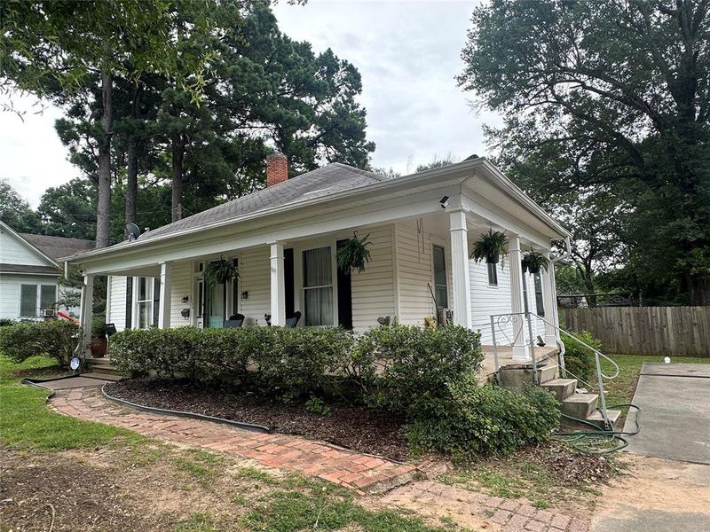 Front exterior of a new home in , Paris, TX, highlighting curb appeal (Image 20). Front exterior of a new home in , Paris, TX, highlighting curb appeal (Image 20).