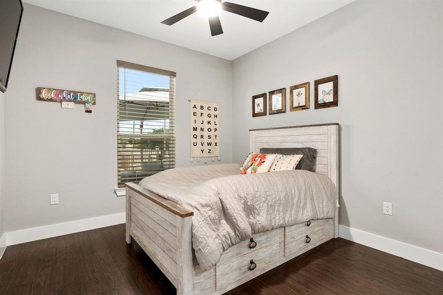 Third Bedroom with View of Side Porch and Pool.