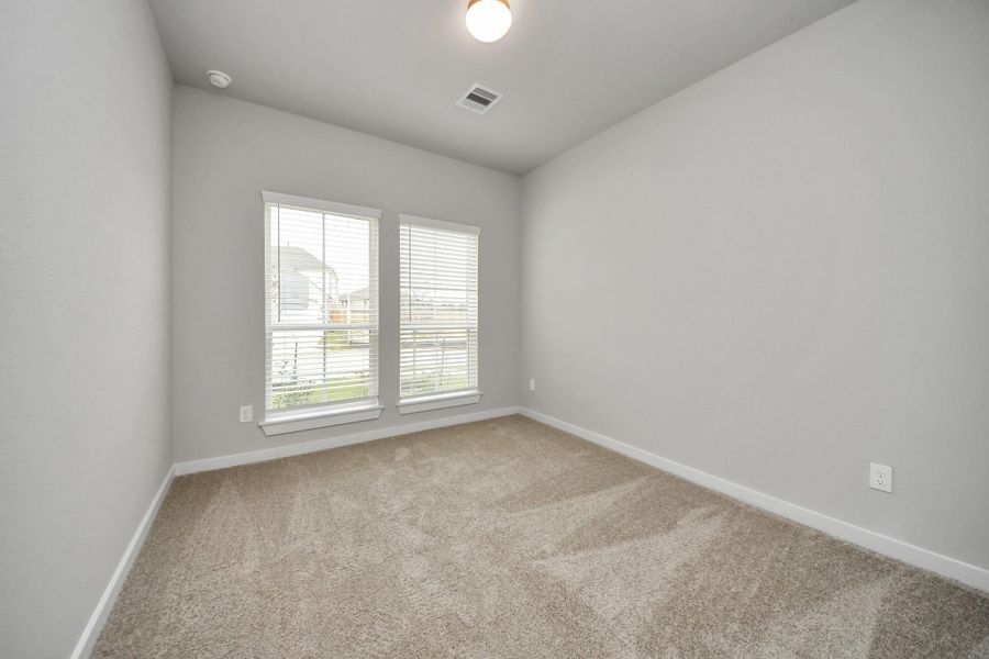 Inviting guest suite adorned with modern charm. Sample photo of completed home with similar floor plan. Actual colors and selections may vary. Inviting guest suite adorned with modern charm. Sample photo of completed home with similar floor plan. Actual colors and selections may vary.