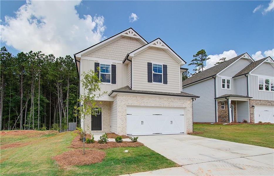 Front exterior of a new home in Enclave at Evergreen, Fairburn, GA, highlighting curb appeal (Image 15).