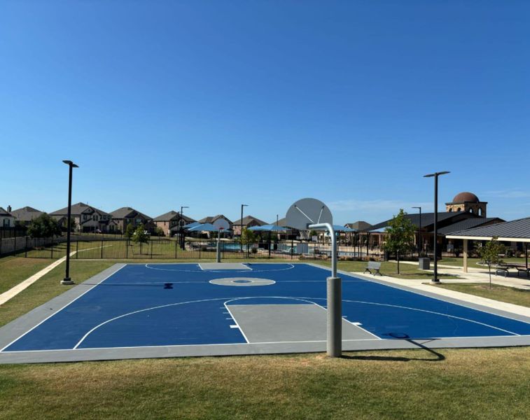 View of sport court featuring community basketball court and a residential view View of sport court featuring community basketball court and a residential view