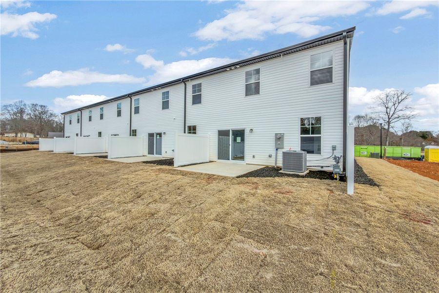 These modern townhomes feature private patios, off These modern townhomes feature private patios, off