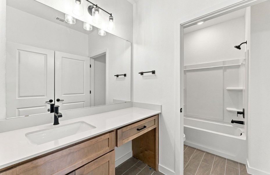 Furnished interior view inside a new home in West Cypress Hills, Spicewood (Image 7).