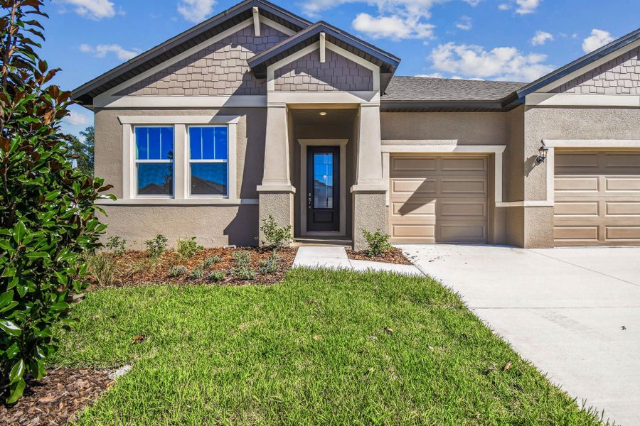 Exterior details and patio area of a home in Pinecone Reserve, Brooksville (Image 3).