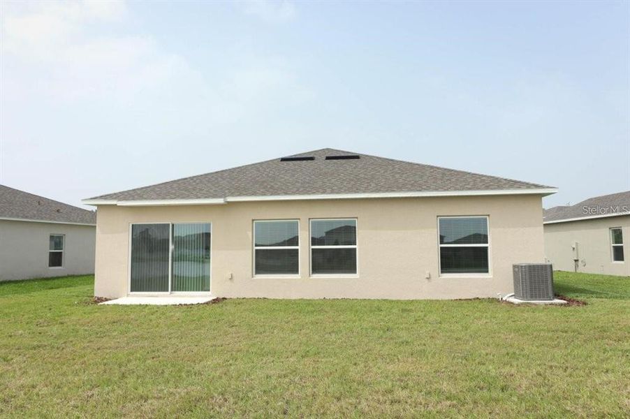 Front exterior of a new home in , Kissimmee, FL, highlighting curb appeal (Image 13).
