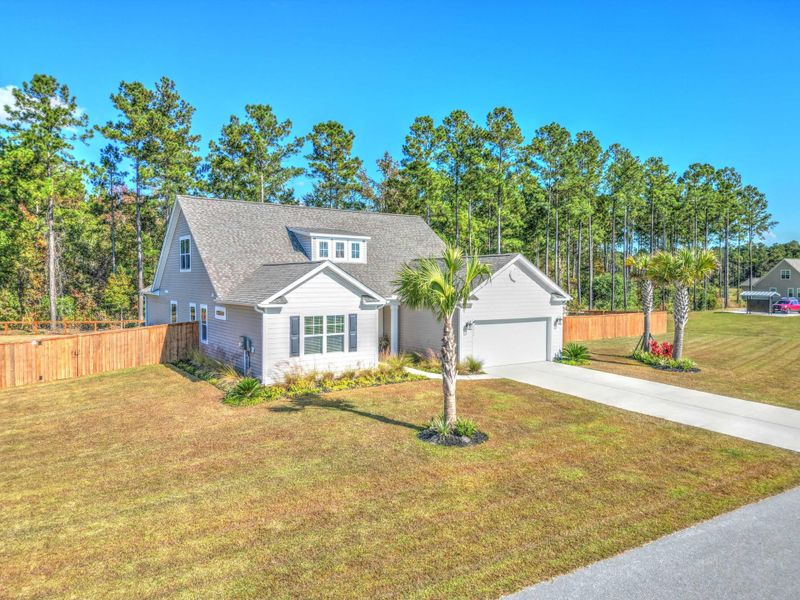 Front exterior of a new home in French Quarter Creek, Huger, SC, highlighting curb appeal (Image 22).