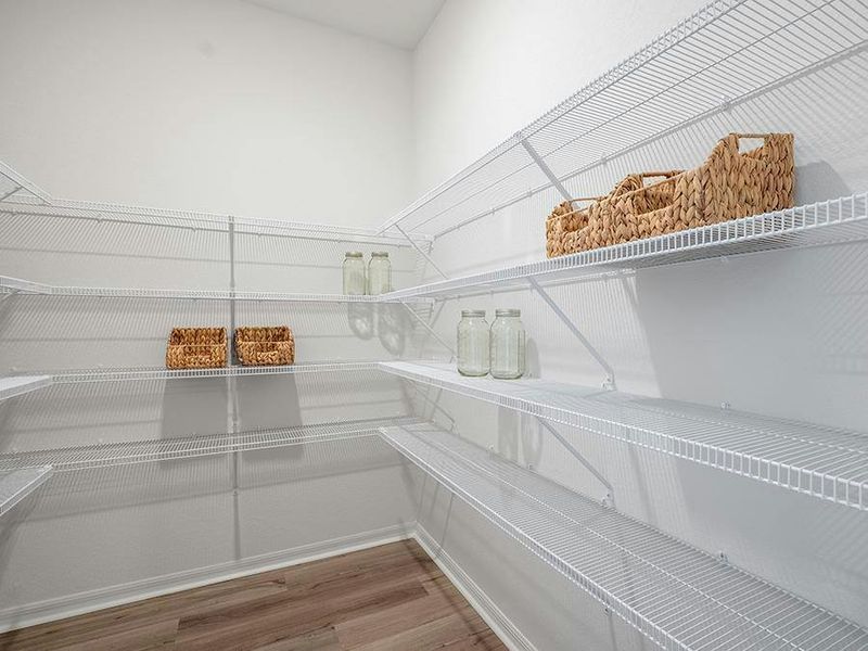 You will find convenient features throughout, such as this walk-in pantry - Monroe by Highland Homes