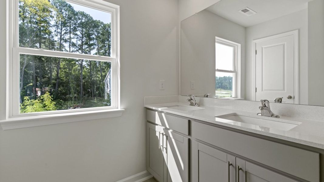 Representative furnished interior of a home built from the LANSING - TRADITIONS by D.R. Horton in Chapel Townes, Raleigh (Image 9).