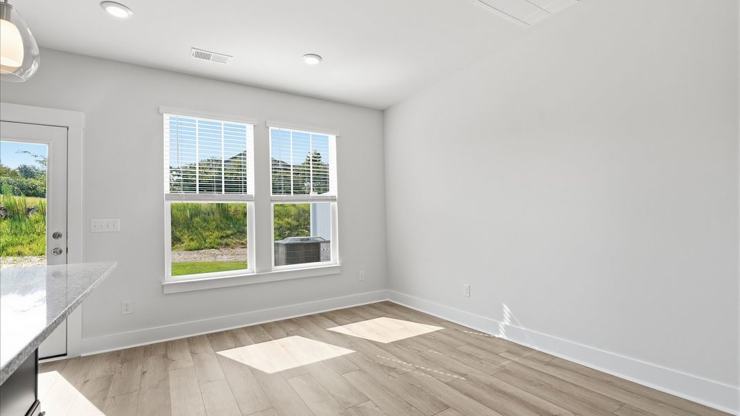 Inviting breakfast area with a seamless connection to the kitchen for everyday living by DRB Homes