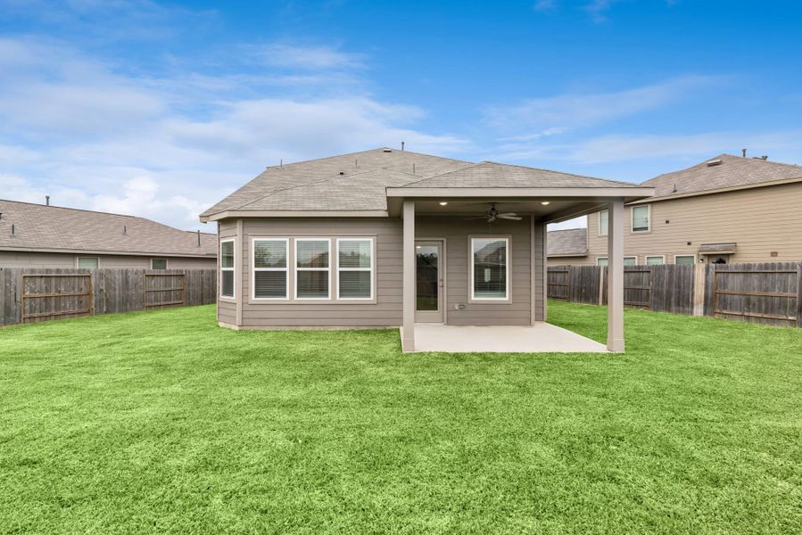 Exterior details and patio area of a home in Pinewood at Grand Texas, New Caney (Image 4).