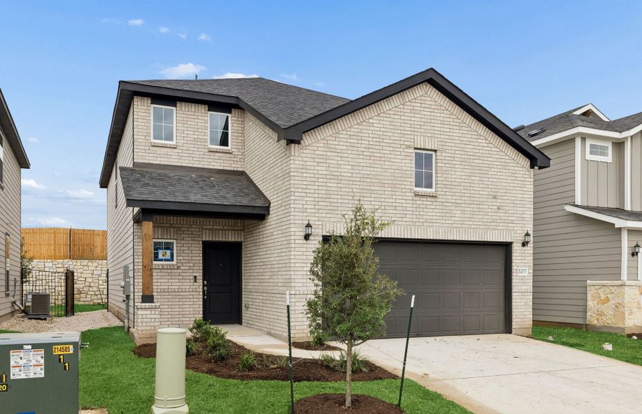 Front exterior of a new home in Cameron Place, Austin, TX, highlighting curb appeal (Image 16). Front exterior of a new home in Cameron Place, Austin, TX, highlighting curb appeal (Image 16).