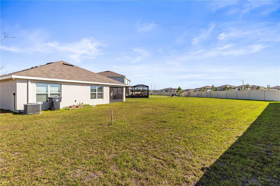 Front exterior of a new home in Berry Bay, Wimauma, FL, highlighting curb appeal (Image 25). Front exterior of a new home in Berry Bay, Wimauma, FL, highlighting curb appeal (Image 25).