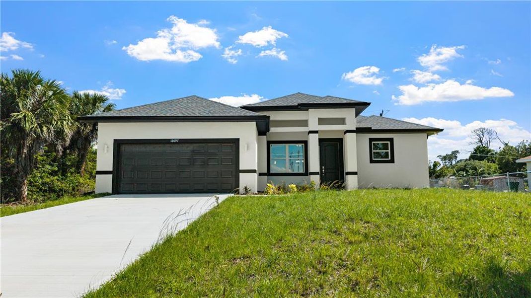 Front exterior of a new home in , Port Charlotte, FL, highlighting curb appeal (Image 21).