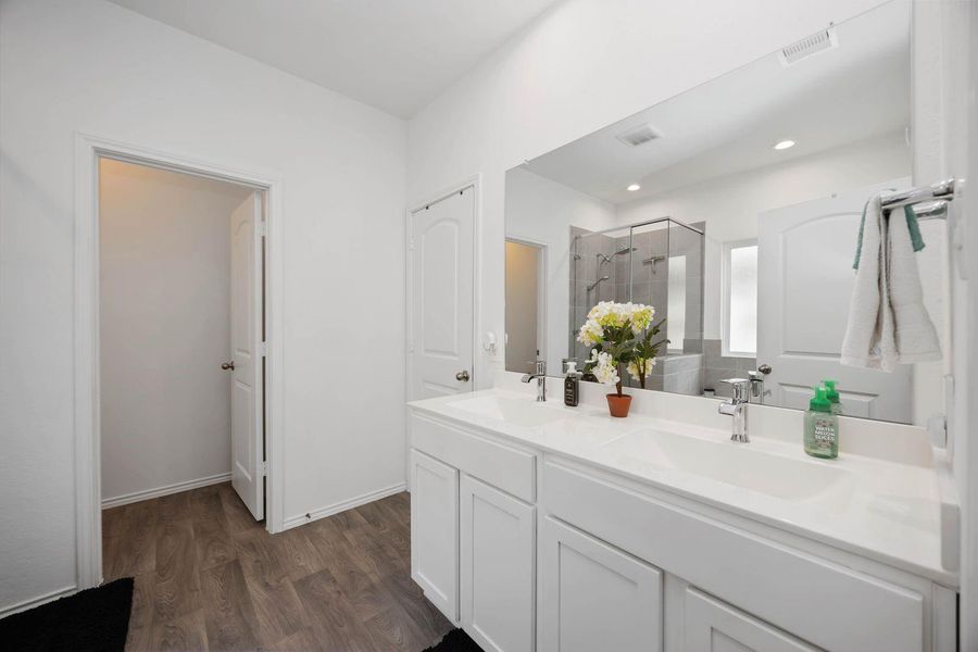 Spa-like en-suite with dual vanities and sleep finishes Spa-like en-suite with dual vanities and sleep finishes