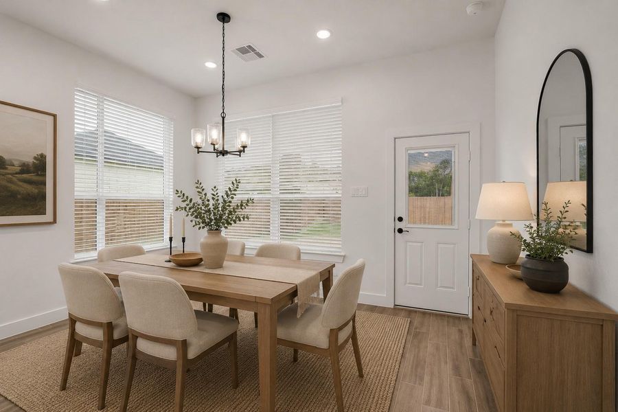 Generous Size Dining area with access to the covered back patio for ease of entertaining or grilling.Virtually staged Photo