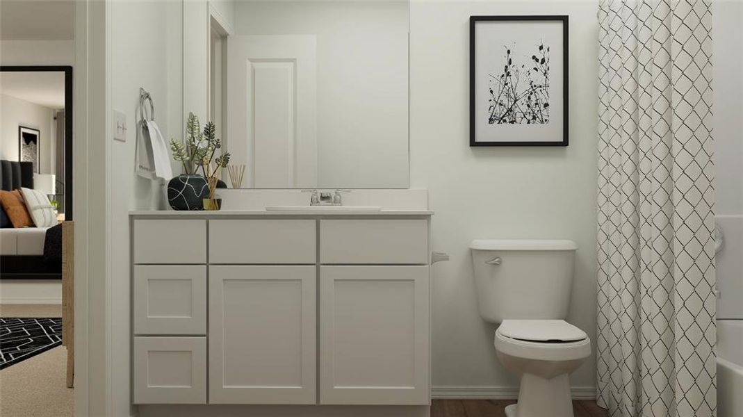 Bathroom with vanity and toilet