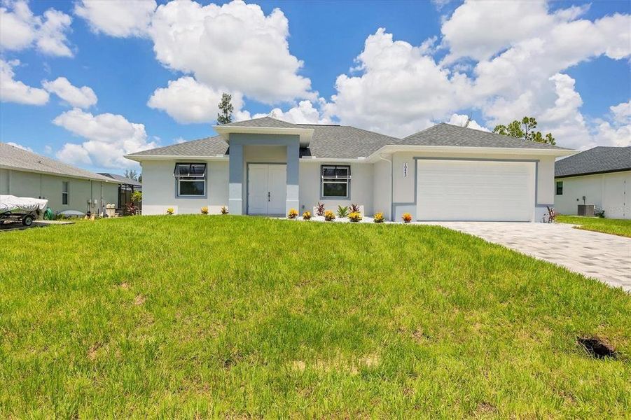 Front exterior of a new home in , Port Charlotte, FL, highlighting curb appeal (Image 23). Front exterior of a new home in , Port Charlotte, FL, highlighting curb appeal (Image 23).