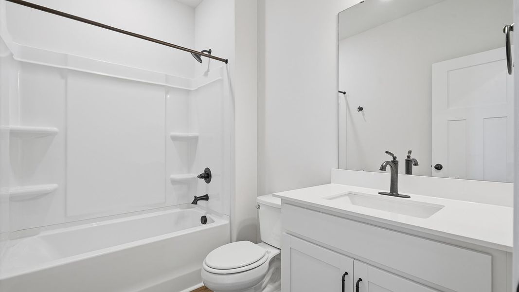 First-class guest bath featuring stylish fixtures and modern design elements First-class guest bath featuring stylish fixtures and modern design elements