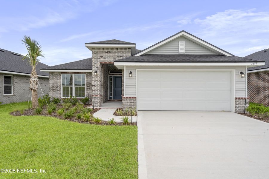 Front exterior of a new home in Shadow Crest at Rolling Hills, Green Cove Springs, FL, highlighting curb appeal (Image 1).