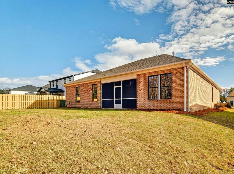 Exterior details and patio area of a home in Collins Cove, Chapin (Image 24).