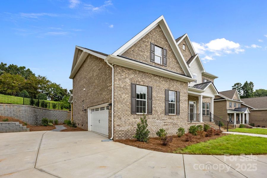 Front exterior of a new home in Stonebridge, Mint Hill, NC, highlighting curb appeal (Image 2). Front exterior of a new home in Stonebridge, Mint Hill, NC, highlighting curb appeal (Image 2).