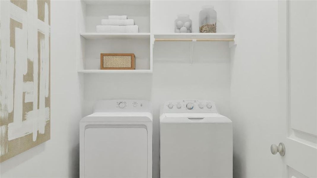 Laundry room featuring separate washer and dryer Laundry room featuring separate washer and dryer