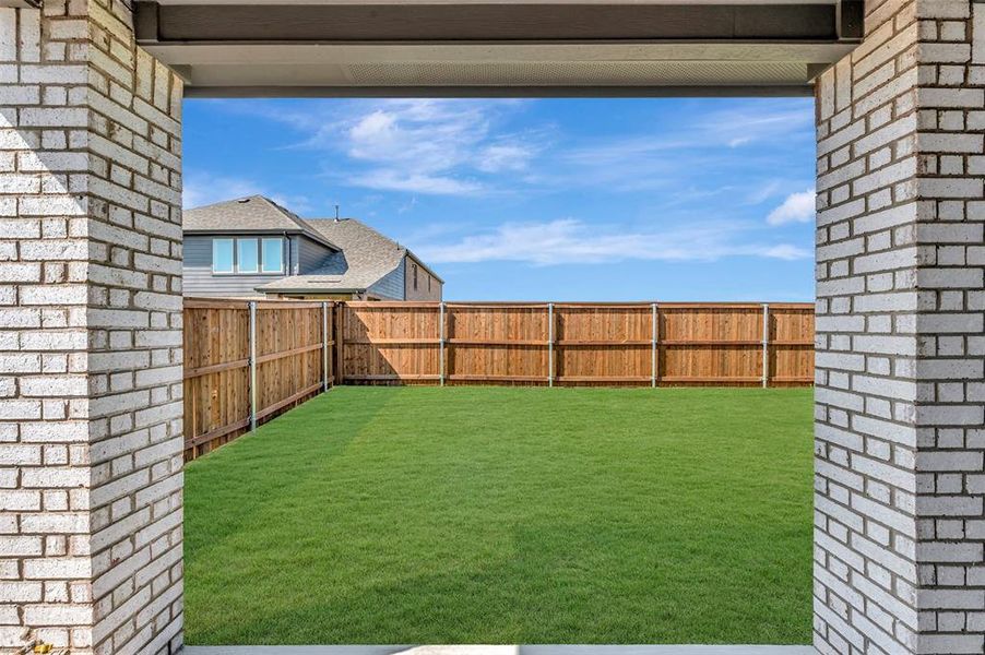 Exterior details and patio area of a home in Lily Creek at Sutton Fields, Aubrey (Image 22).