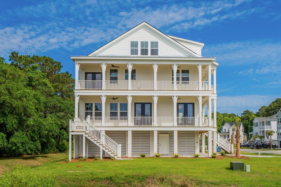 Front exterior of a new home in Overlook at Copahee Sound, Awendaw, SC, highlighting curb appeal (Image 1). Front exterior of a new home in Overlook at Copahee Sound, Awendaw, SC, highlighting curb appeal (Image 1).