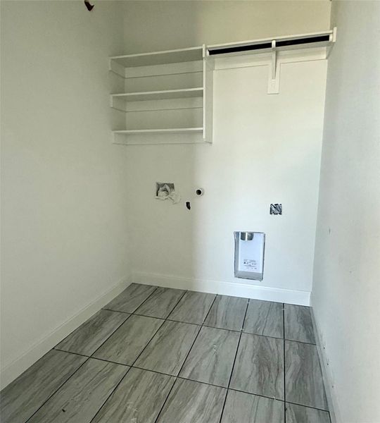 Laundry area with baseboards and laundry area Laundry area with baseboards and laundry area