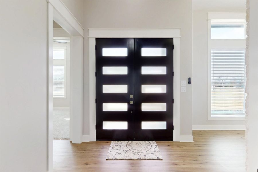 Lovely designer doors in an extra wide and enviting entry full of light 17.66x8.08