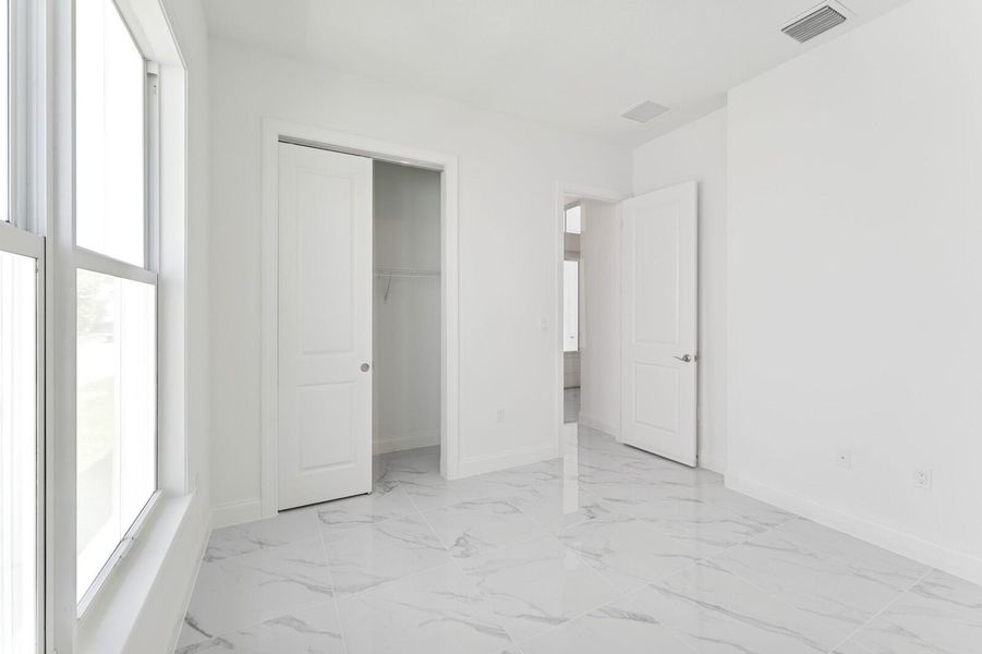 Furnished interior view inside a new home in Salerno Reserve - Single Family, Stuart (Image 12). Furnished interior view inside a new home in Salerno Reserve - Single Family, Stuart (Image 12).