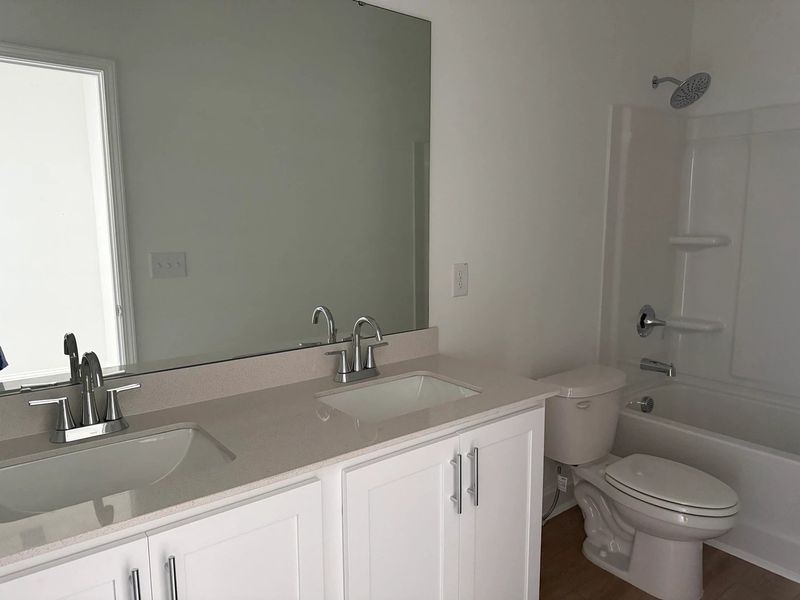 Bath 2 featuring the AW Collection® Coastal - Clean lines and light finishes welcome guests. Bath 2 featuring the AW Collection® Coastal - Clean lines and light finishes welcome guests.