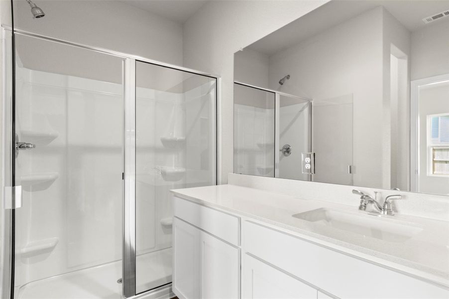 Full bath with a stall shower and vanity Full bath with a stall shower and vanity