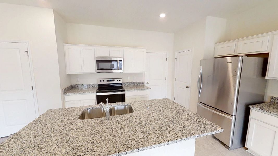 Representative furnished interior of a home built from the Voyager by Starlight Homes in Landings at Mount Olive, Polk City (Image 3).