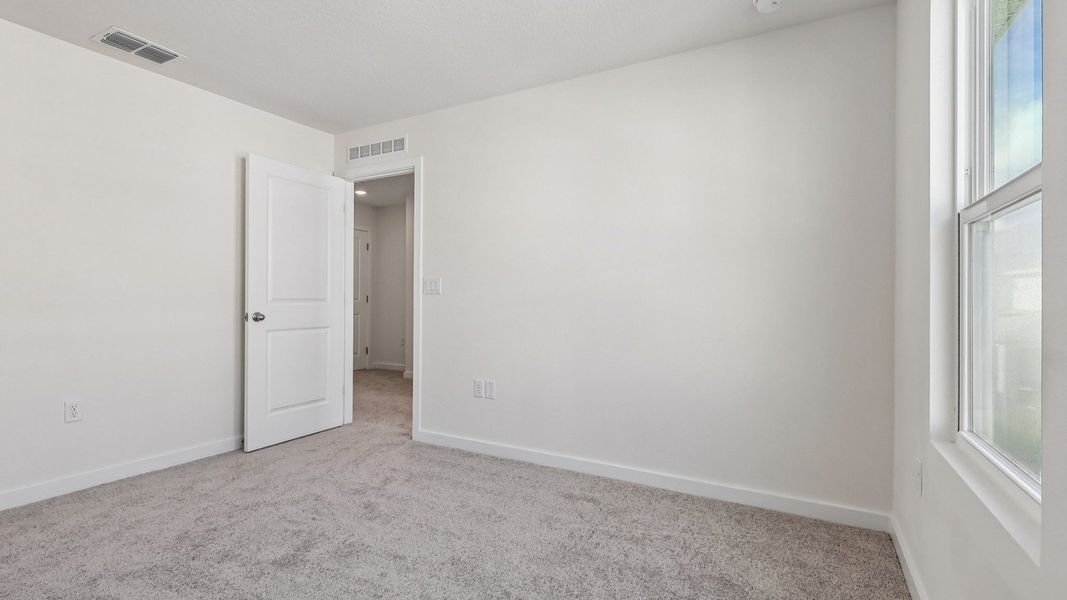 Furnished interior view inside a new home in Cyrene at Harmony, St. Cloud (Image 20).