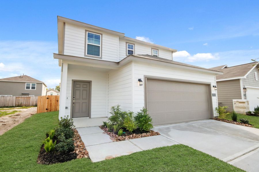 Front exterior of a new home in Northpark South, Porter, TX, highlighting curb appeal (Image 16). Front exterior of a new home in Northpark South, Porter, TX, highlighting curb appeal (Image 16).