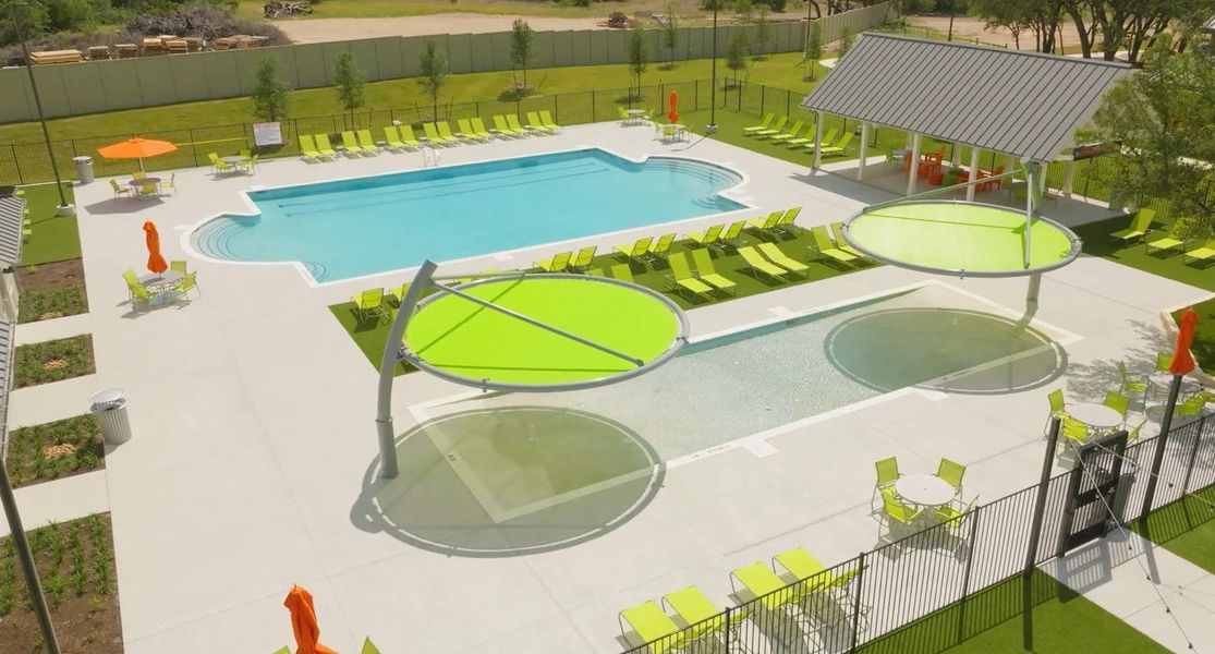 An inviting pool area with ample lounging options and a sheltered pavilion for gatherings.